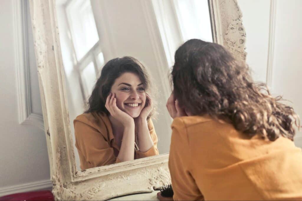 Woman looking at mirror
