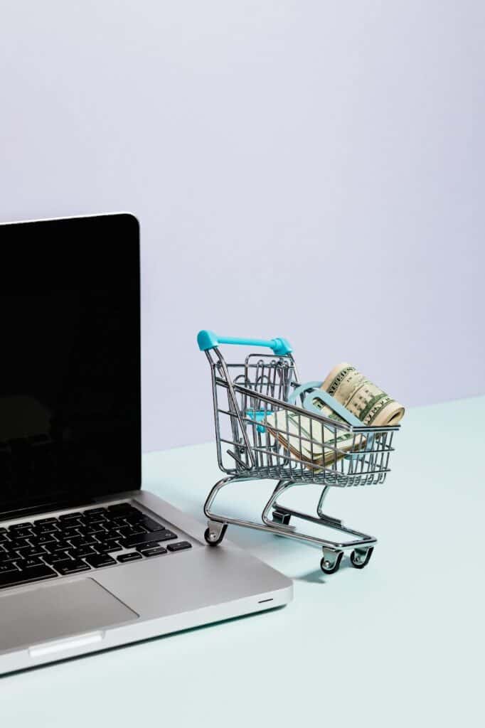 Image depicting money in a shopping cart