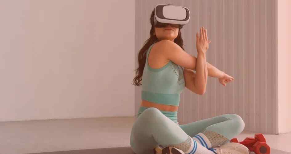 Person doing yoga while wearing a virtual reality headset.